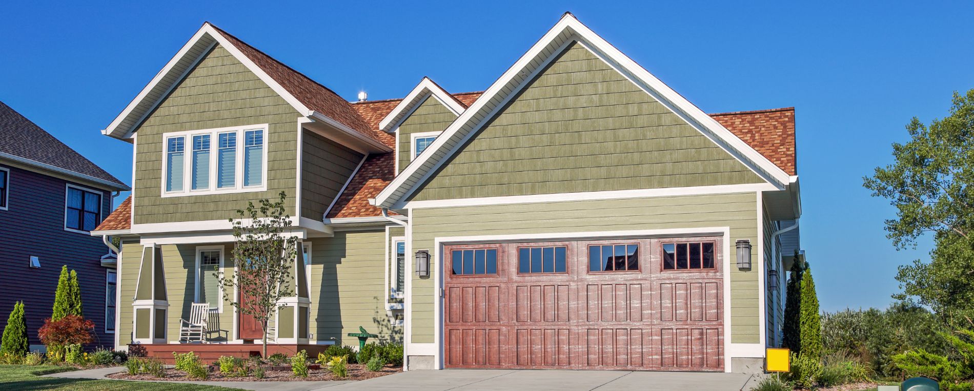 Modern suburban home with new garage door